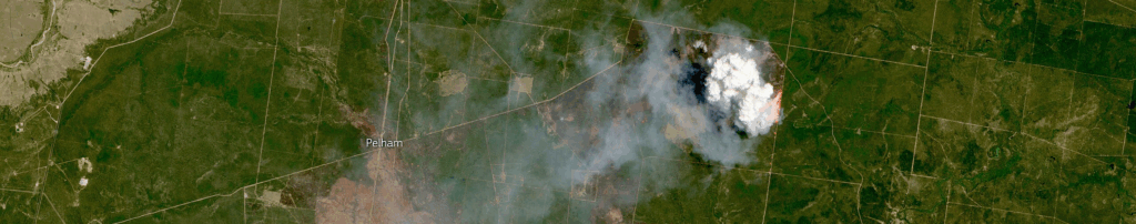 Satellite image of a smoking bushfire over Queensland, Australia